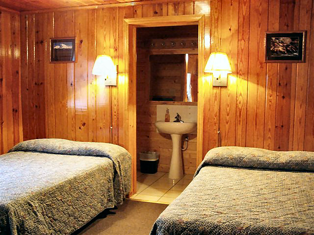 2 Bedroom Cabin: Two Double Beds room #2 with half bath sink and shower.