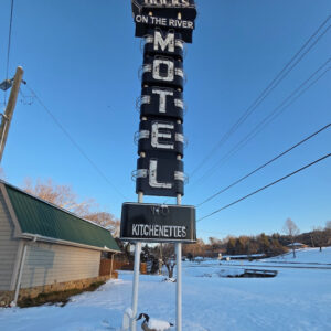 Dock's Motel sign in the winter with snow on the ground