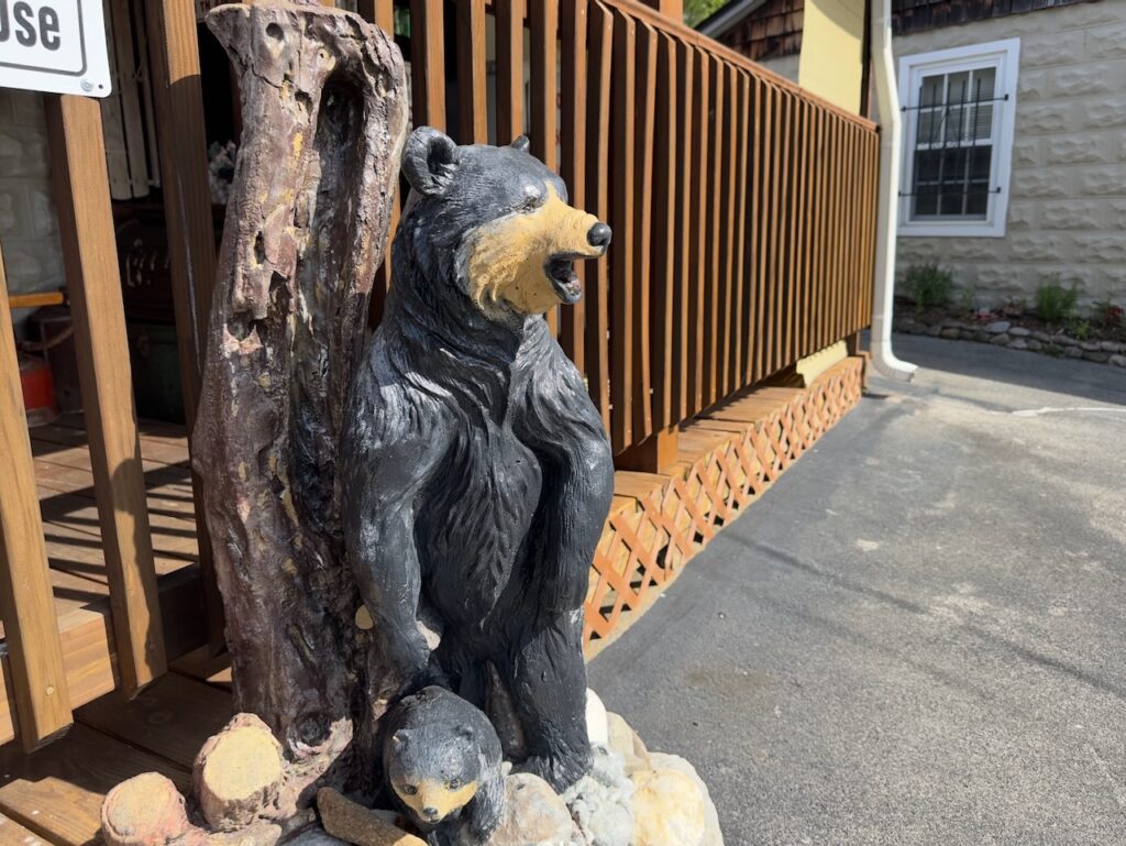 sculpture of a black bear in front of the office at Dock's