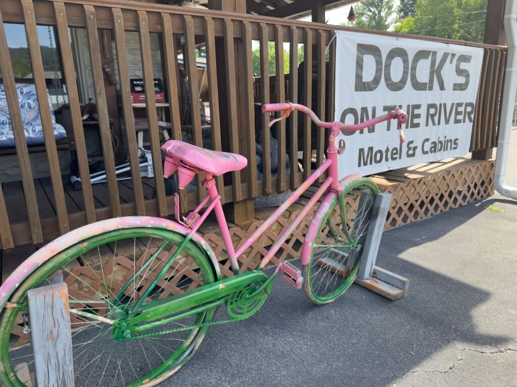 Old bike sitting on the side of the office at Dock's Motel