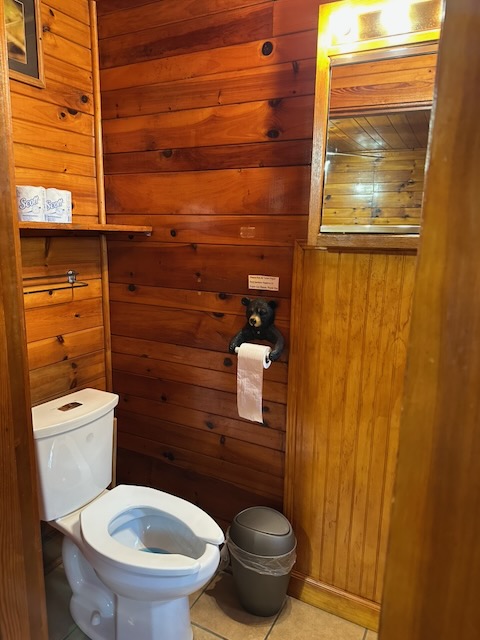 King Efficiency Suite Second bathroom 1/2 bath showing toilet and vanity mirror