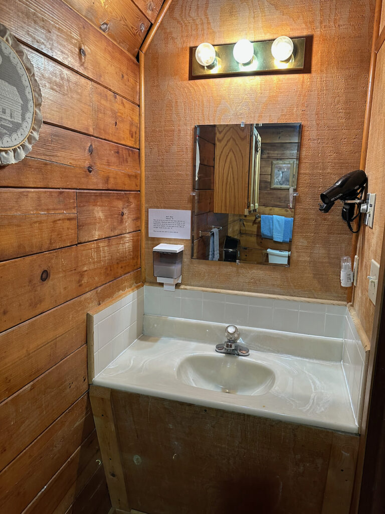 cabin 21, 23, 23 bathroom vanity with sink, mirror, hairdryer