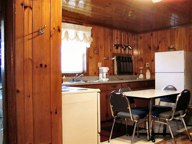 2 Bed Kitchenette: full kitchen, refrigerator, stove, coffee maker, microwave, dishes, pots and pans.