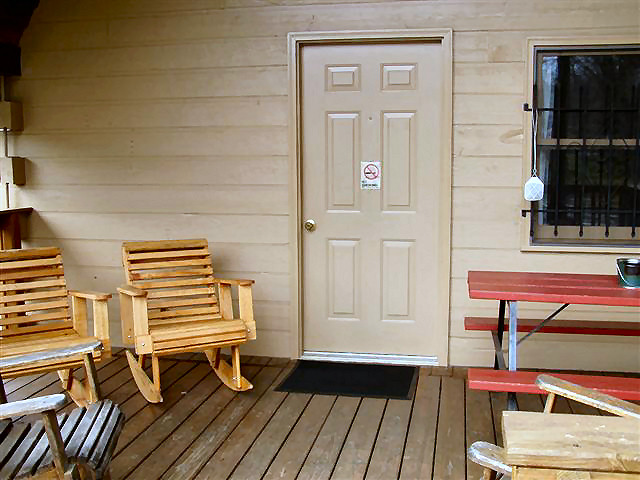 Big Cabin: Deck with picnic table and rocking chairs.