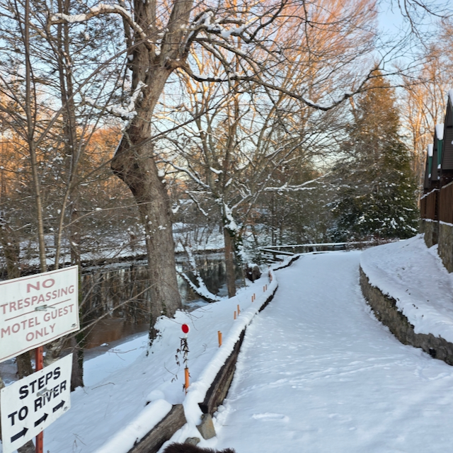 snow-covered path down to the private picnic area at Dock's Motel