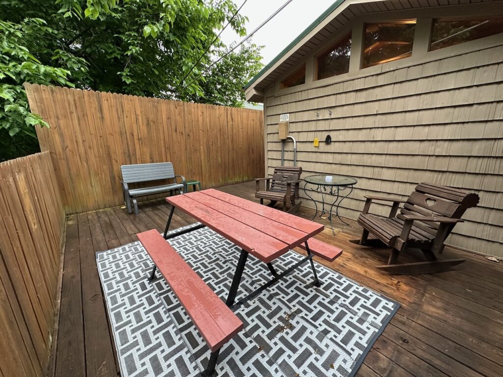 Deck with picnic table and chairs showing privacy fencing around the deck