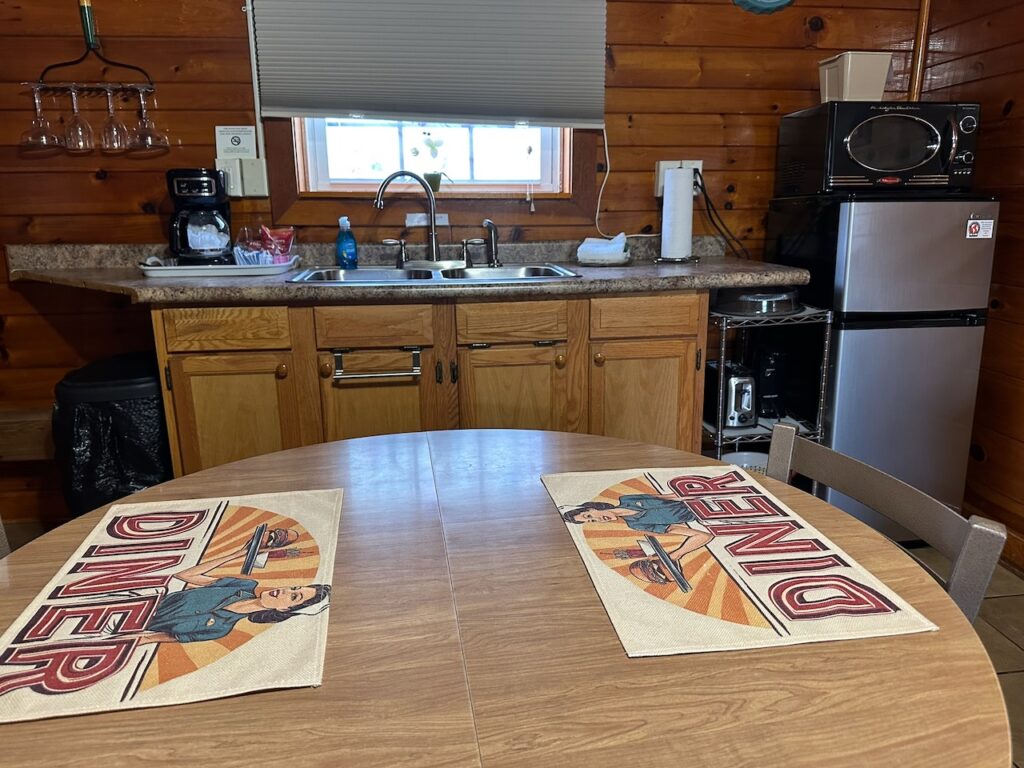 Efficiency kitchen in room 1 at docks motel showing full fridge and counter top with sink
