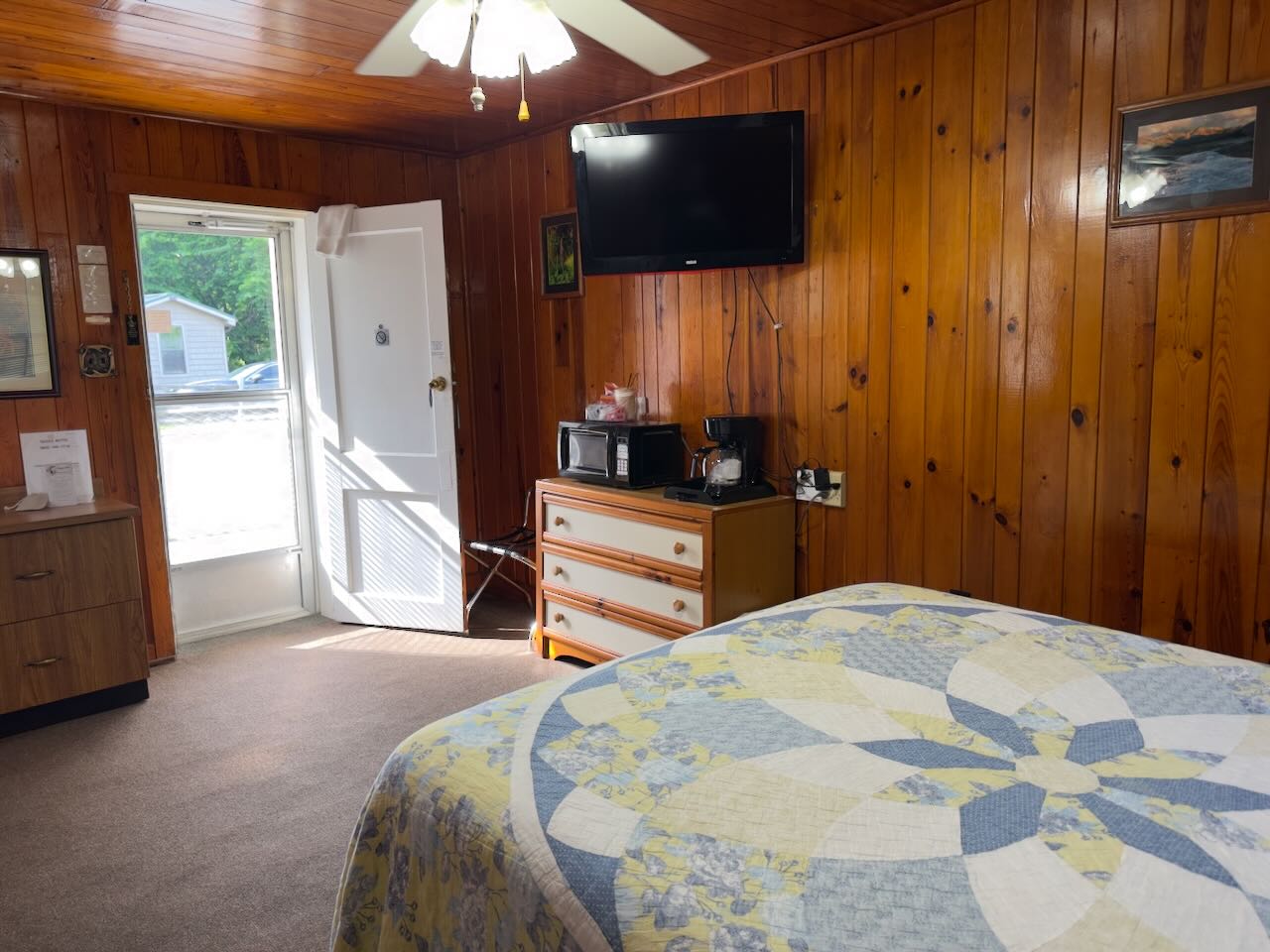 room 14 bed, tv, and amenities of microwave, coffee maker, and mini-fridge
