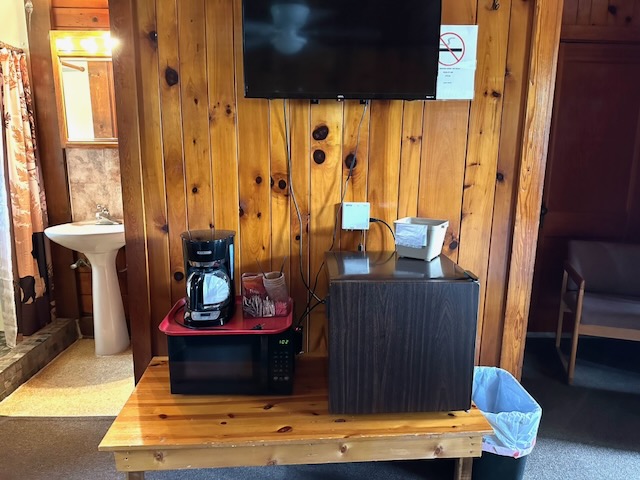 Room 4 amenities showing mini fridge, coffee maker, and microwave