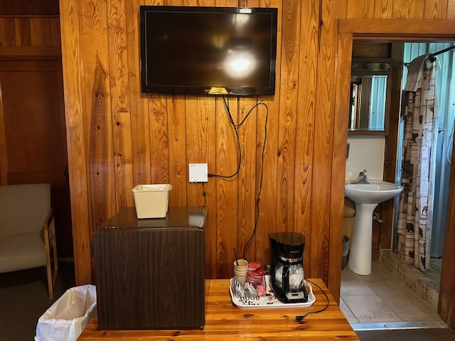 Motel room showing amenities of coffee maker and mini-fridge