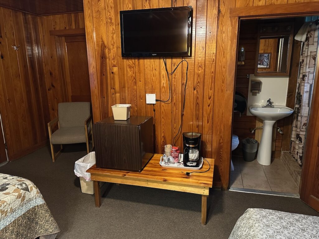 Motel Room with Flat screen TV, mini fridge, and Coffee maker